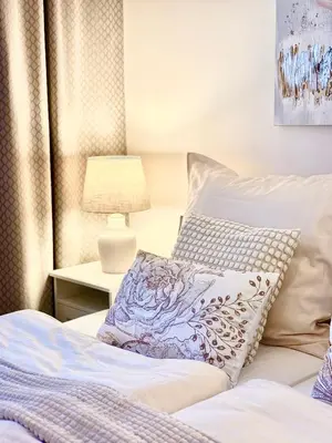 a bedroom with a bed with a pillow on it at My Sweet Home - Zakšínská - Prague in Prague