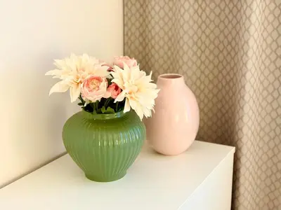 two vases sitting on a shelf with flowers in them at My Sweet Home - Zakšínská - Prague in Prague
