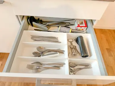 a drawer full of utensils in a cabinet at Serene Apartment near Wenceslas Sq & Main Station in Prague