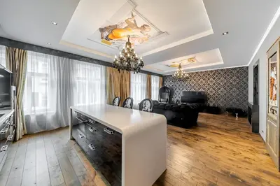 a living room with a white table and a couch at 2 BR Designer Apartment in Old Town in Prague