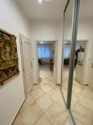 a room with a hallway with a mirror on the wall at Jakub's home in Prague