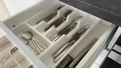 a drawer filled with silver utensils in a kitchen at NEW beautiful apartment 15 minutes from the city center in Prague