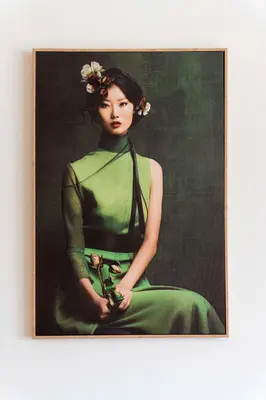 a painting of a woman in a green dress at Timeless Elegance Suite in Prague