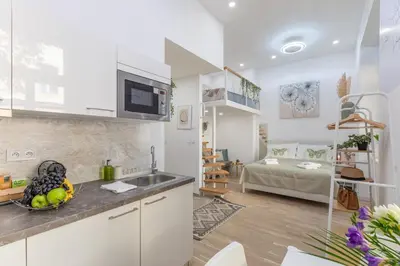 a kitchen with a sink and a counter top at Newly renovated flat with a loft in Prague