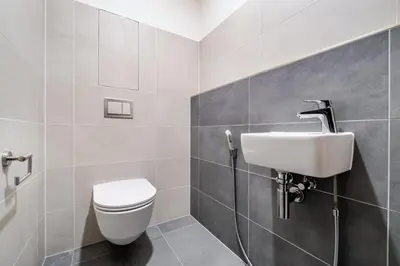 a desk with a chair and a picture on the wall at Blueground Prague 7 furnished close to offices PRG-12 in Prague