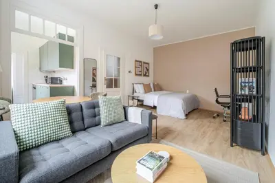 a living room with a couch and a table at Blueground Anděl view nr Vltava River PRG-80 in Prague
