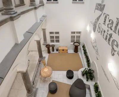 an overhead view of a living room with a staircase at 7 Tales Apartments by Adrez in Prague