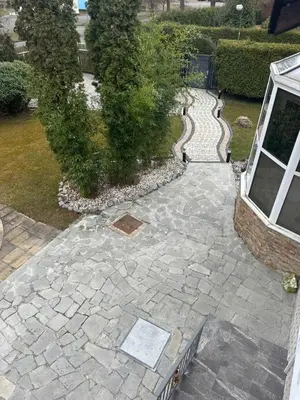 an overhead view of a patio with a stone walkway at Dream House Prague East in Kamenice