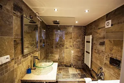 a bathroom with a sink and a shower at Ruterra Red Roofs View With Garage in Prague