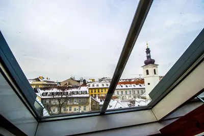 a view of a city from a window at Ruterra Red Roofs View With Garage in Prague