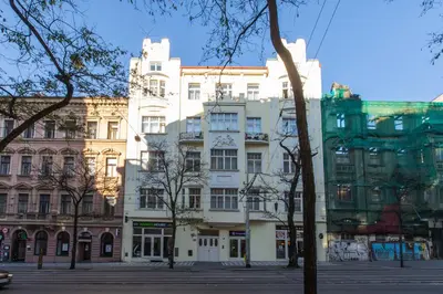 a group of buildings on a city street at Ječná Stylish Residence - Charles Square, Old town in Prague