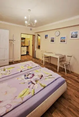 a bedroom with a large bed with bananas on it at Veles Apartment in Prague