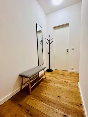 a room with a bench and a mirror at Studio above the Muzeum in Prague