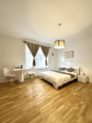 a bedroom with a bed and a desk at Entire apartment in the center of Prague in Prague