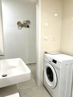 a washing machine in a bathroom next to a sink at Entire apartment in the center of Prague in Prague