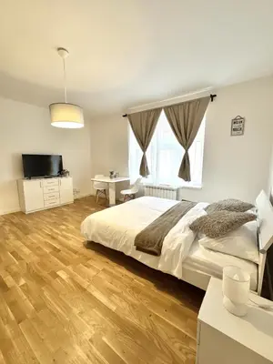 a bedroom with a bed and a large window at Entire apartment in the center of Prague in Prague