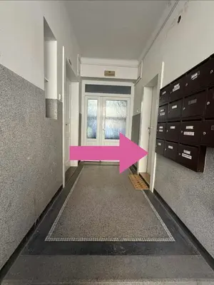 an empty hallway with a pink arrow in a room at Diamond suite in Prague
