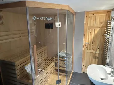 a sauna with a toilet and a sink at Prague Luxury Apartment in Prague