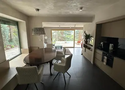 a kitchen and dining room with a table and chairs at Prague Luxury Apartment in Prague
