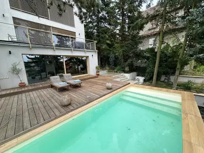 a swimming pool in the backyard of a house at Prague Luxury Apartment in Prague
