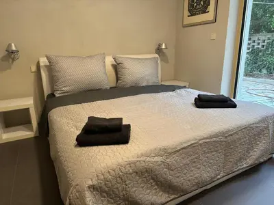 a bedroom with a bed with two towels on it at Prague Luxury Apartment in Prague