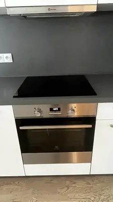 a kitchen with an oven with a microwave at Residence Garden Tower - 8 min do centra, garaz in Prague