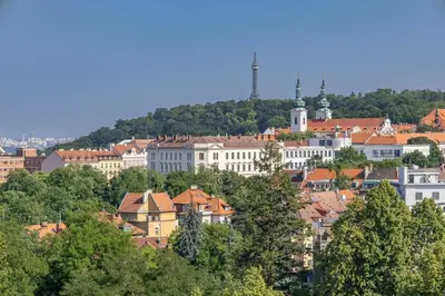 a view of a city with buildings and trees at Spacious House with Garden 15 min walk from Castle in Prague