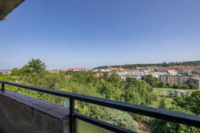 a view of a city from a balcony at Spacious House with Garden 15 min walk from Castle in Prague