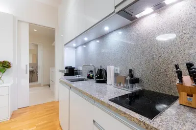 a kitchen with a sink and a counter top at Residence near the Old Town Square in Prague