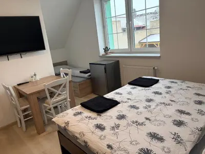 a small kitchen with a sink and a microwave at Apartmán ve Zlonicích blízko Prahy in Zlonice