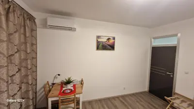 a room with a desk and a table and a window at Fully renovated apartment by Anděl metro in Prague