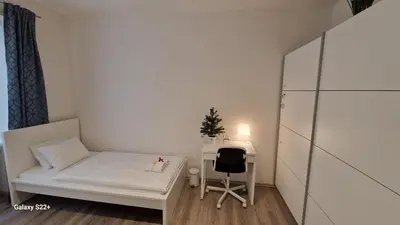 a small room with a bed and a desk at Fully renovated apartment by Anděl metro in Prague