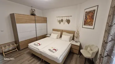 a bedroom with a bed with two shoes on it at Fully renovated apartment by Anděl metro in Prague