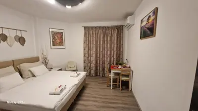 a hotel room with two beds and a table at Fully renovated apartment by Anděl metro in Prague
