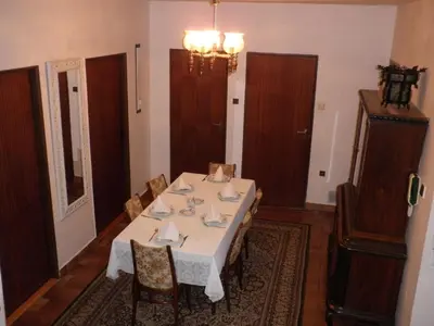 a dining room with a white table and chairs at Pension Arcadia Prague in Prague
