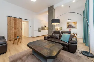 a living room with a couch and a table at Apartment Vinohradská 14 in Prague