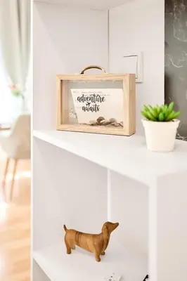 a shelf with a picture of a dog on it at Royal Apart in Prague