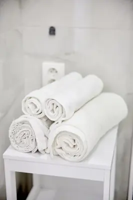 a pile of towels sitting on top of a table at Royal Apart in Prague