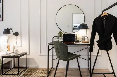 a room with a desk with a chair and a mirror at Prague Days - Two Bedroom Apartment with Parking and Netflix in Karlín in Prague