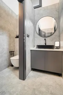 a bathroom with a sink and a mirror at KYRA Apartments by Rentez in Prague