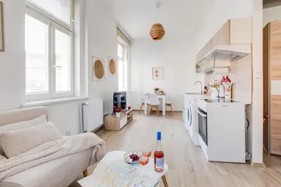 a bathroom with a sink and a shower and a toilet at Jane's Cozy Corner Studio in Prague