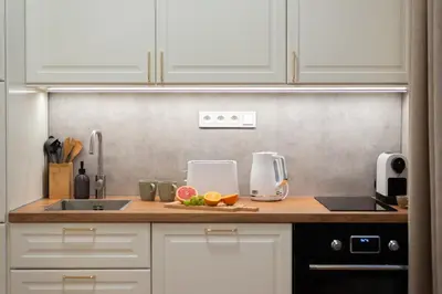 a kitchen counter with a cutting board with fruit on it at Little Oasis in Prague