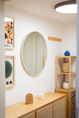 a bathroom with a mirror and a wooden dresser at Little Oasis in Prague