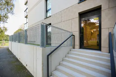 a set of stairs leading up to a building at Rotunda Residence - with free weekend parking in Prague