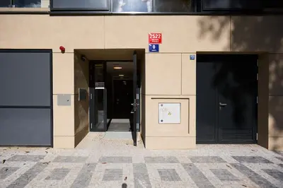 two entrances to a building with two doors at Rotunda Residence - with free weekend parking in Prague