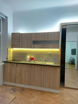 a kitchen with a sink and a mirror at Sophia apartment in Prague