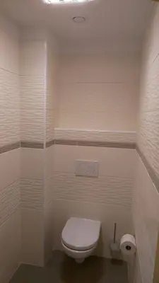 a bathroom with a toilet and a glass shower at Podřipská Farma in Roudnice nad Labem