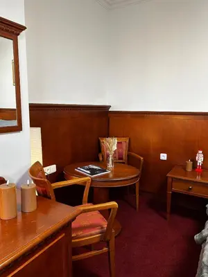 a dining room with a table and a table and chairs at Balbinova Grand Apartment Private Balcony in Prague