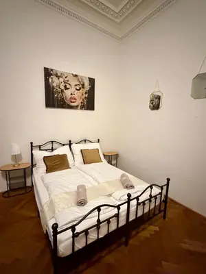 a bedroom with a large bed in a room at Zitna Downtown Residence in Prague