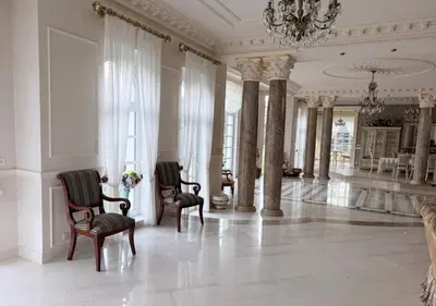 a large room with chairs and a chandelier at Luxury Villa